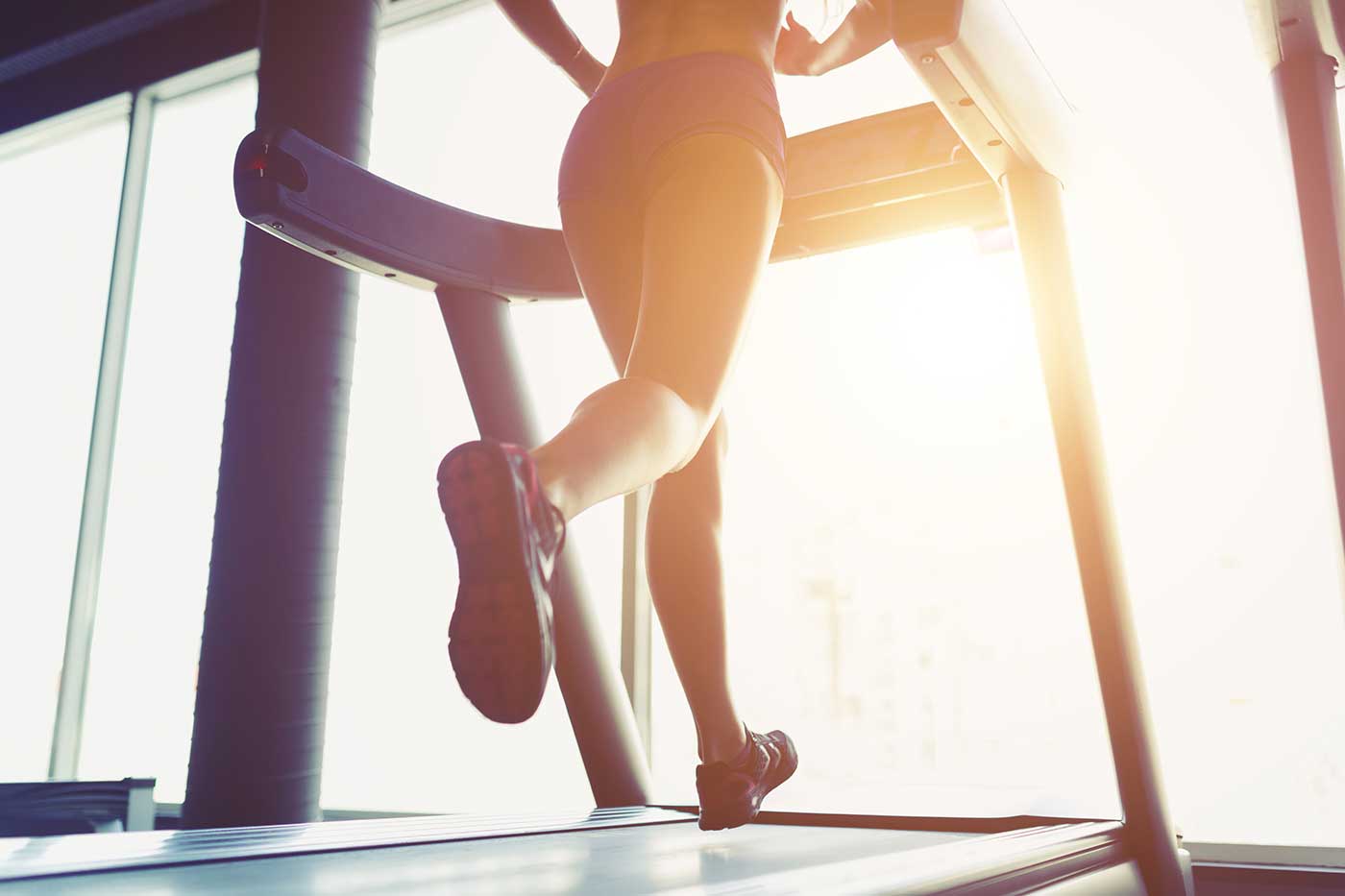 Woman jogging on a treadmill